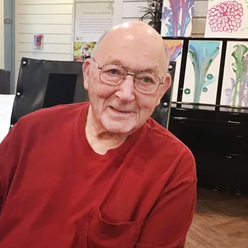 Resident smiling at Oxford Glen Memory Care at Grand Prairie in Grand Prairie, Texas