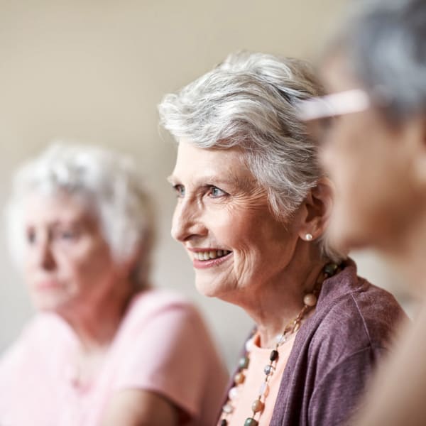 A resident listening to a talk at Sellwood Senior Living in Portland, Oregon. 