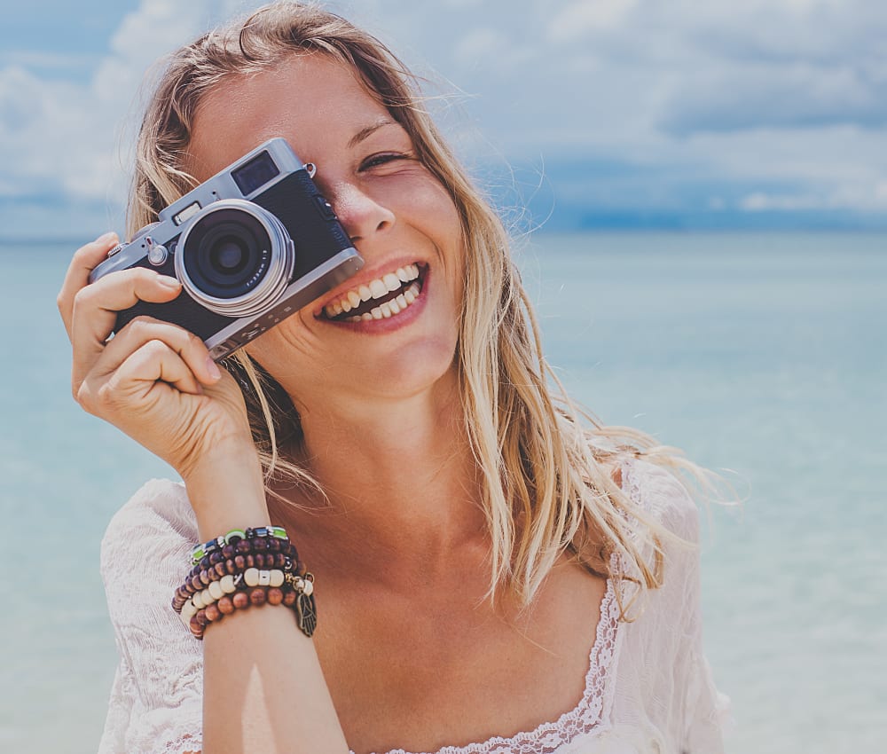 Resident taking a photo at Allina La Jolla in San Diego, California