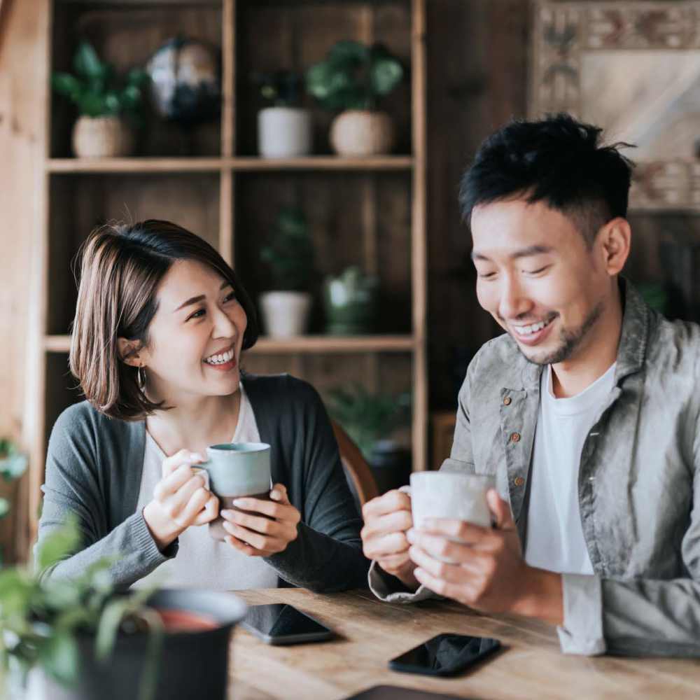 Couple having coffee in a cafe near Pacific Shores in Santa Cruz, California