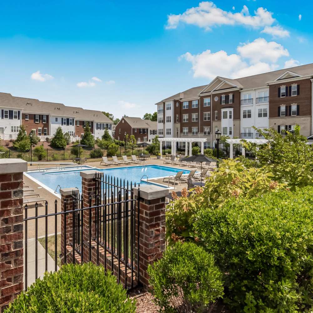 Outdoor pool and apartment community view at Meadow Branch Apartments in Winchester, Virginia