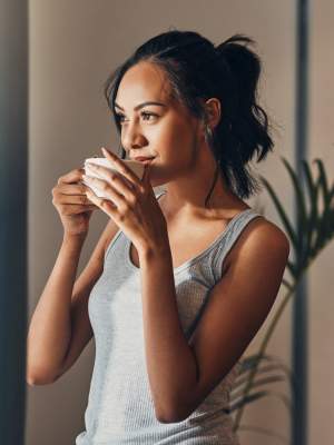 Resident with a cup of coffee at The Abbey at Hightower in North Richland Hills, Texas