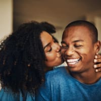 Two residents kissing at The Presidio in Pensacola, Florida