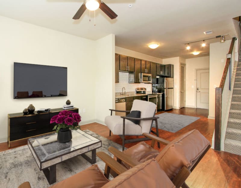 Model living room with view of kitchen at 401 Oberlin in Raleigh, North Carolina