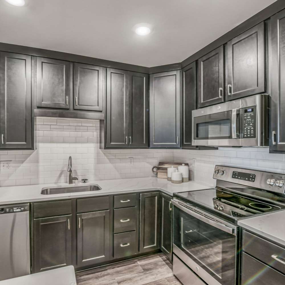 Kitchen with stainless-steel appliances at Newport Avenue Apartments, Rumford, Rhode Island