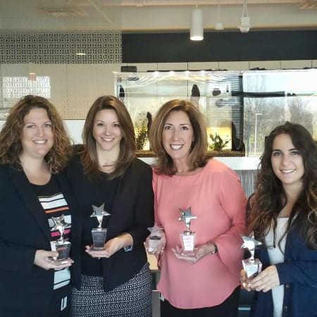 Team accepting an award for Vantage Management in Gaithersburg, Maryland