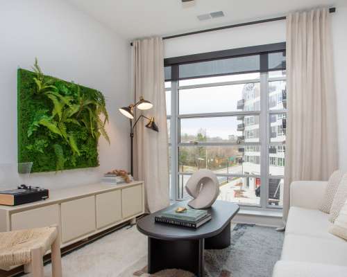 living room furnished with floor to ceiling windows at The Row in Raleigh,North Carolina