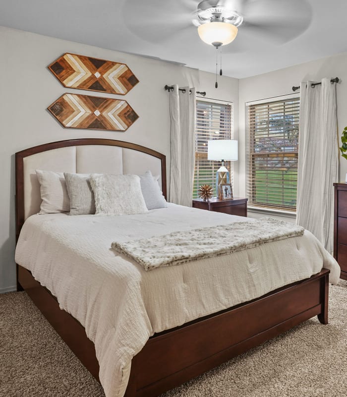 Spacious carpeted bedroom at Coffee Creek Apartments in Owasso, Oklahoma