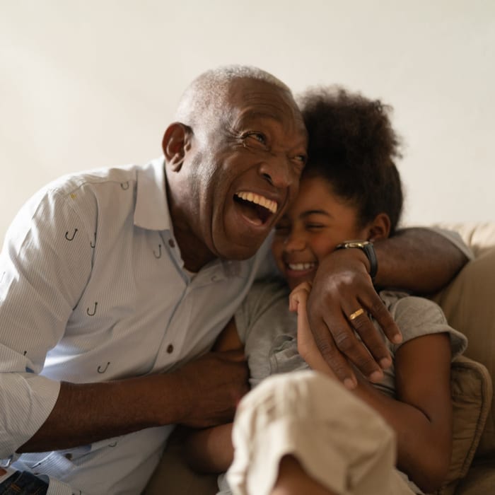 Laughing resident and granddaughter at Heritage House in Clearwater, Florida