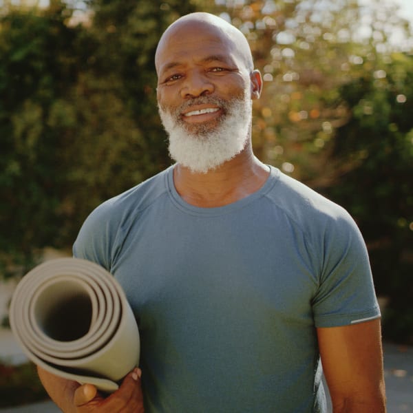 Resident smiling and feeling terrific after a yoga class at Pacifica Senior Living Encinitas in Encinitas, California