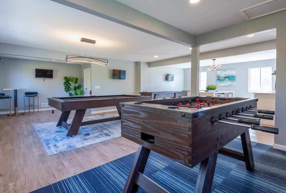 Game room with billiards and foosball at Waverlywood Apartments & Townhomes in Webster, New York