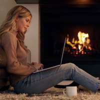 Resident in her apartment with fireplace at Stadium West Apartments in Arlington, Texas