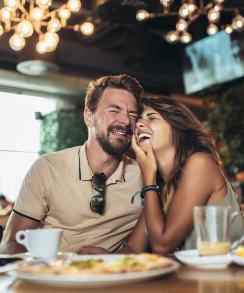 A couple having meals at their favorite restaurant near The Edison Sugarloaf in Lawrenceville, Georgia