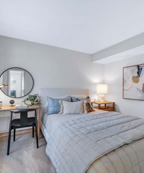 Queen-size bed in a model bedroom at Muirwood in Farmington Hills, Michigan