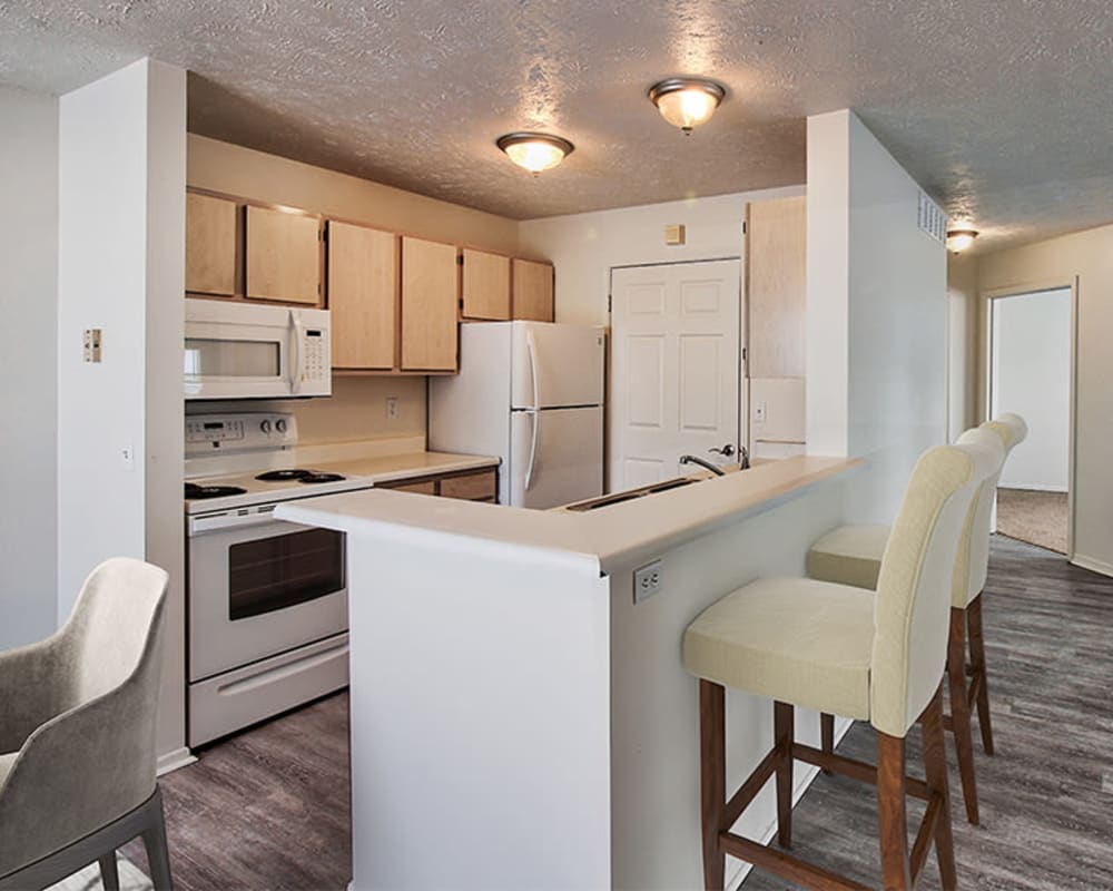 Model kitchen with a breakfast bar at Astoria Park Apartment Homes in Indianapolis, Indiana
