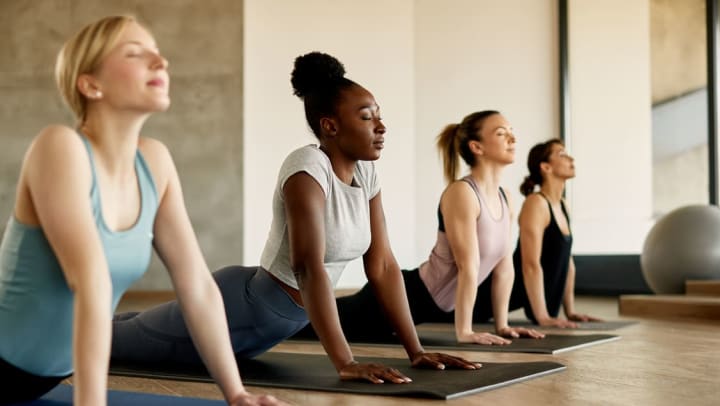 group of women practicing during a yoga class | yoga studios around Destin