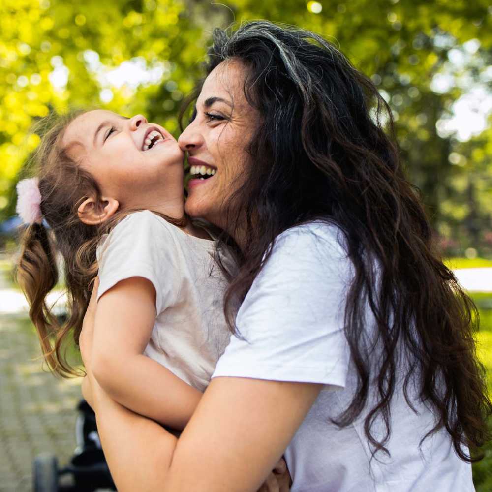 Resident woman playing with her kid at The Calvert in Charlotte, North Carolina