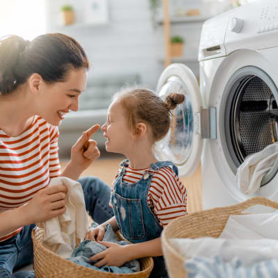 a mother and daughter doing laundry at Norwich Manor in Norfolk, Virginia