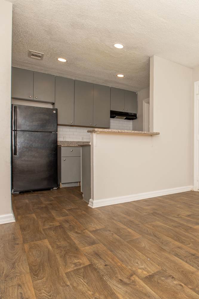 Apartment kitchen at Fredericksburg Place Apartments in San Antonio, Texas