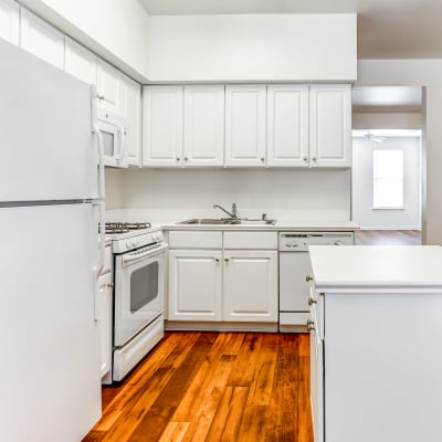 A kitchen with appliances in a home at Gateway Village in San Diego, California