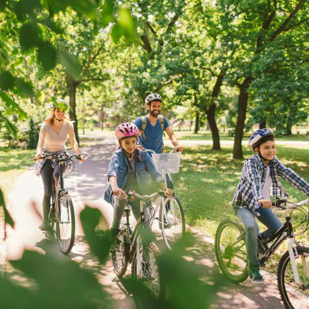 Family biking together near Vintage Park in Houston, Texas