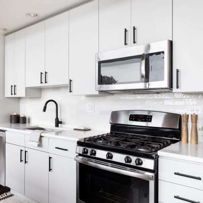 Modern kitchen with gas stove at The Garnett in Brooklyn, New York