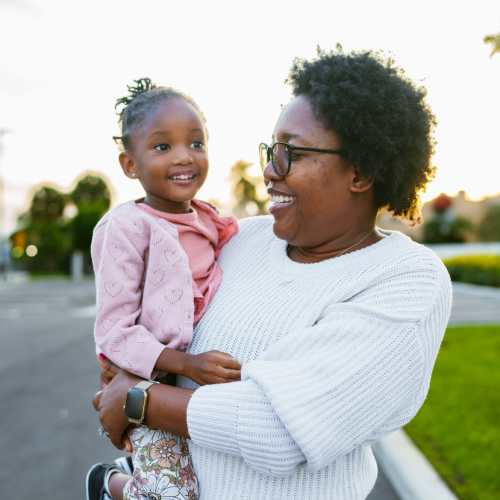 Resident with her kid at Stonebridge Apartments in West Jordan, Utah