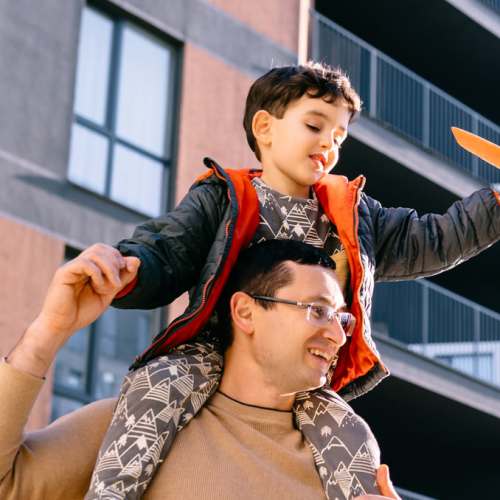 Resident playing with his kid at Williston Pointe in Gainesville, Florida