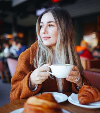Resident having coffee at a cafe near 5 Row in Charlottesville, Virginia