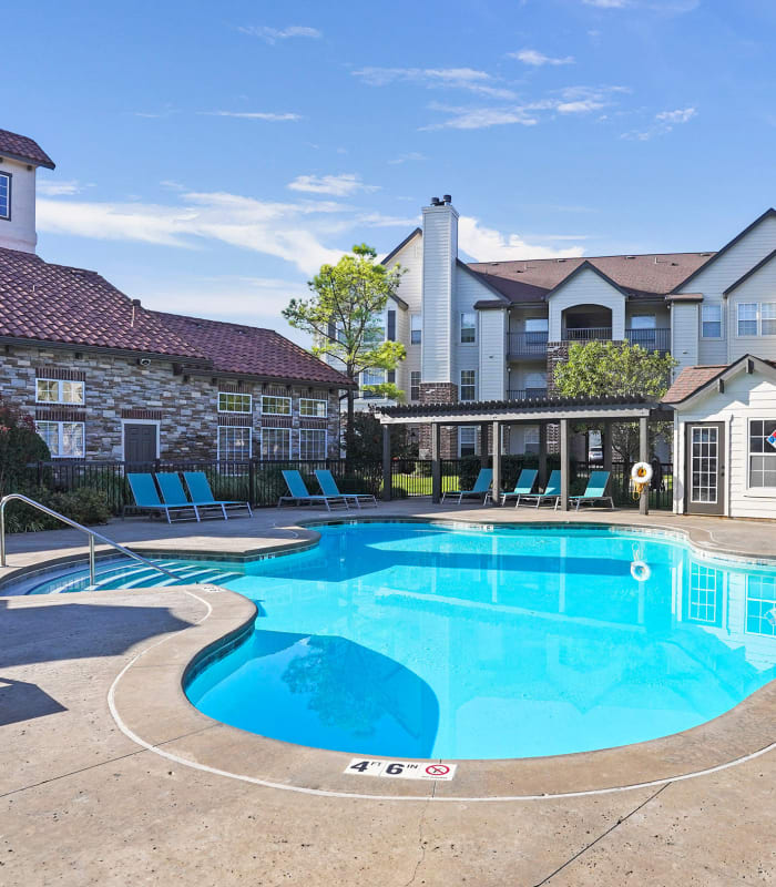 The Sparkling pool and sundeck outside of Park at Mission Hills in Broken Arrow, Oklahoma