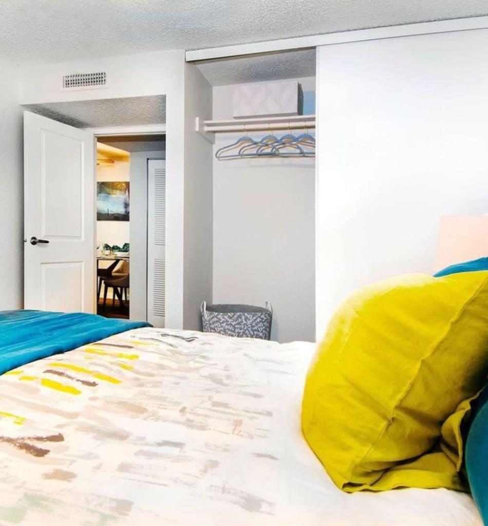 Nice closet in the bedroom to hang your clothes in a model home at Sofi Belmar in Lakewood, Colorado