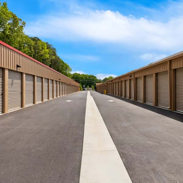 Indoor storage units with bright doors at StorQuest Self Storage in Merced, California