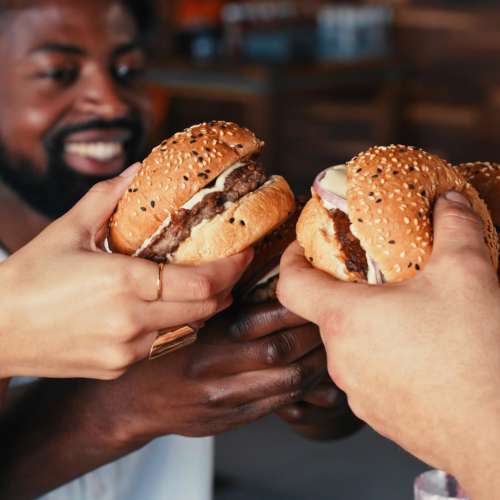 Residents having burgers at a restaurant near The Sycamores in Indianapolis,Indiana