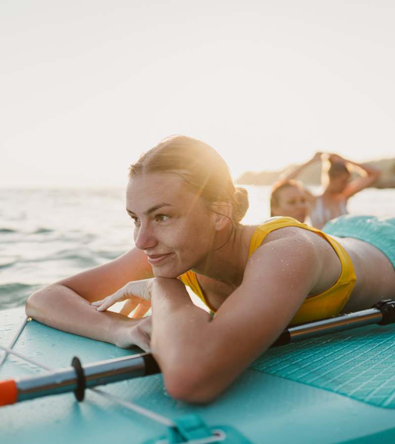 Floating on a paddleboard near Palm Bay Club in Palm Bay, Florida