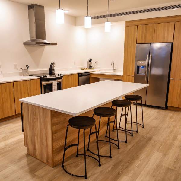 Wood cabinets and stainless-steel appliances in an apartment kitchen at The Beacon in Cleveland, Ohio