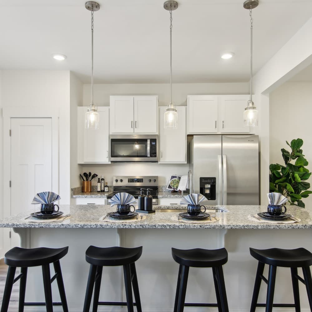 Eat-in island kitchen at Artisan Living Mills River in Mills River, North Carolina
