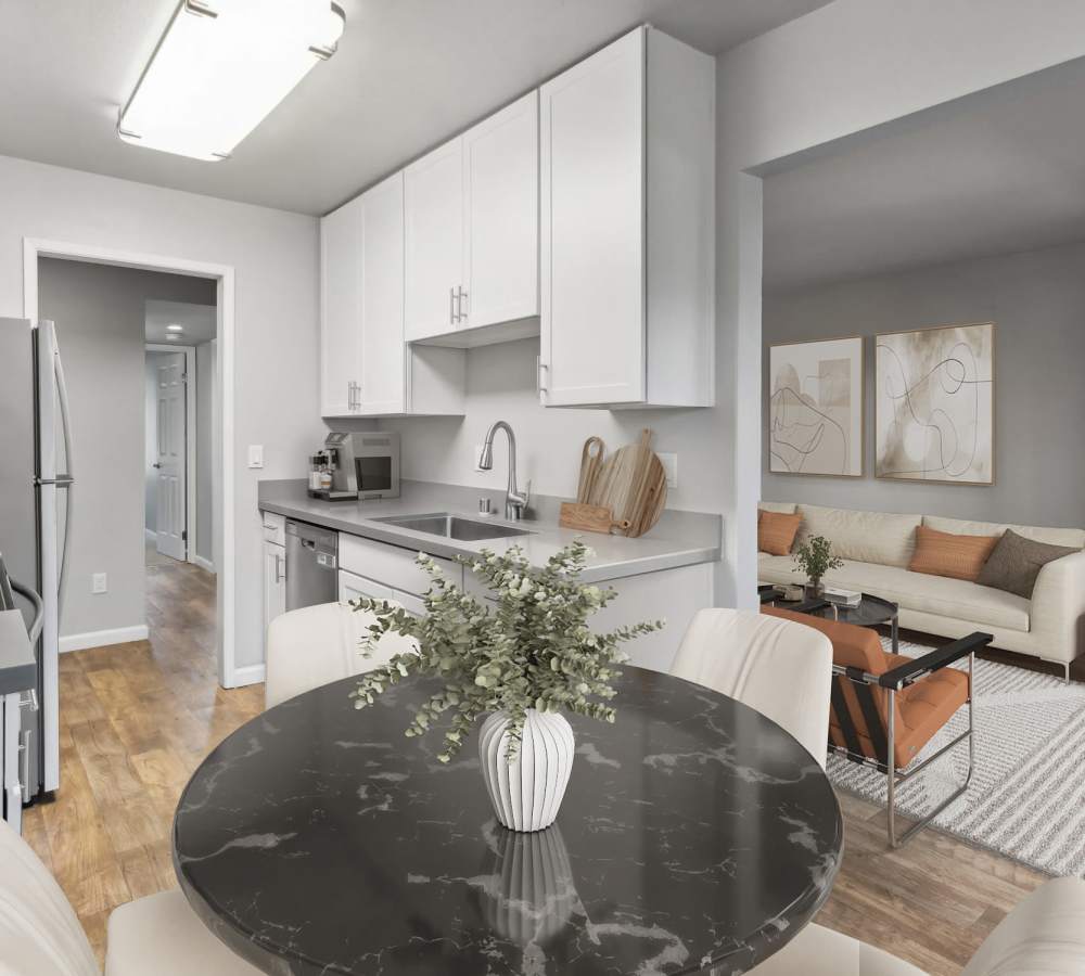 Dining area looking into updated kitchen and living room