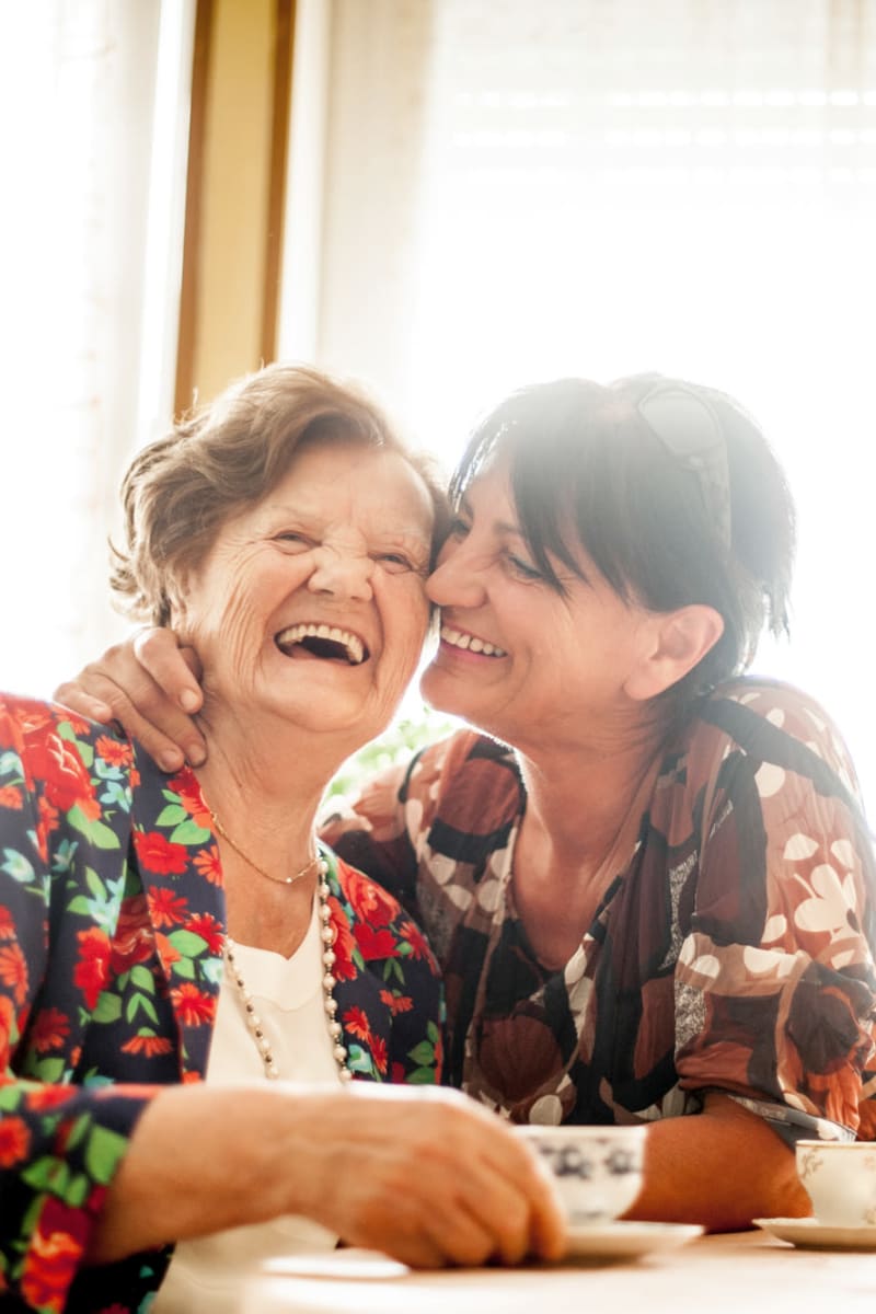 Resident and caretaker embracing at Transitions At Home - West in Mount Horeb, Wisconsin