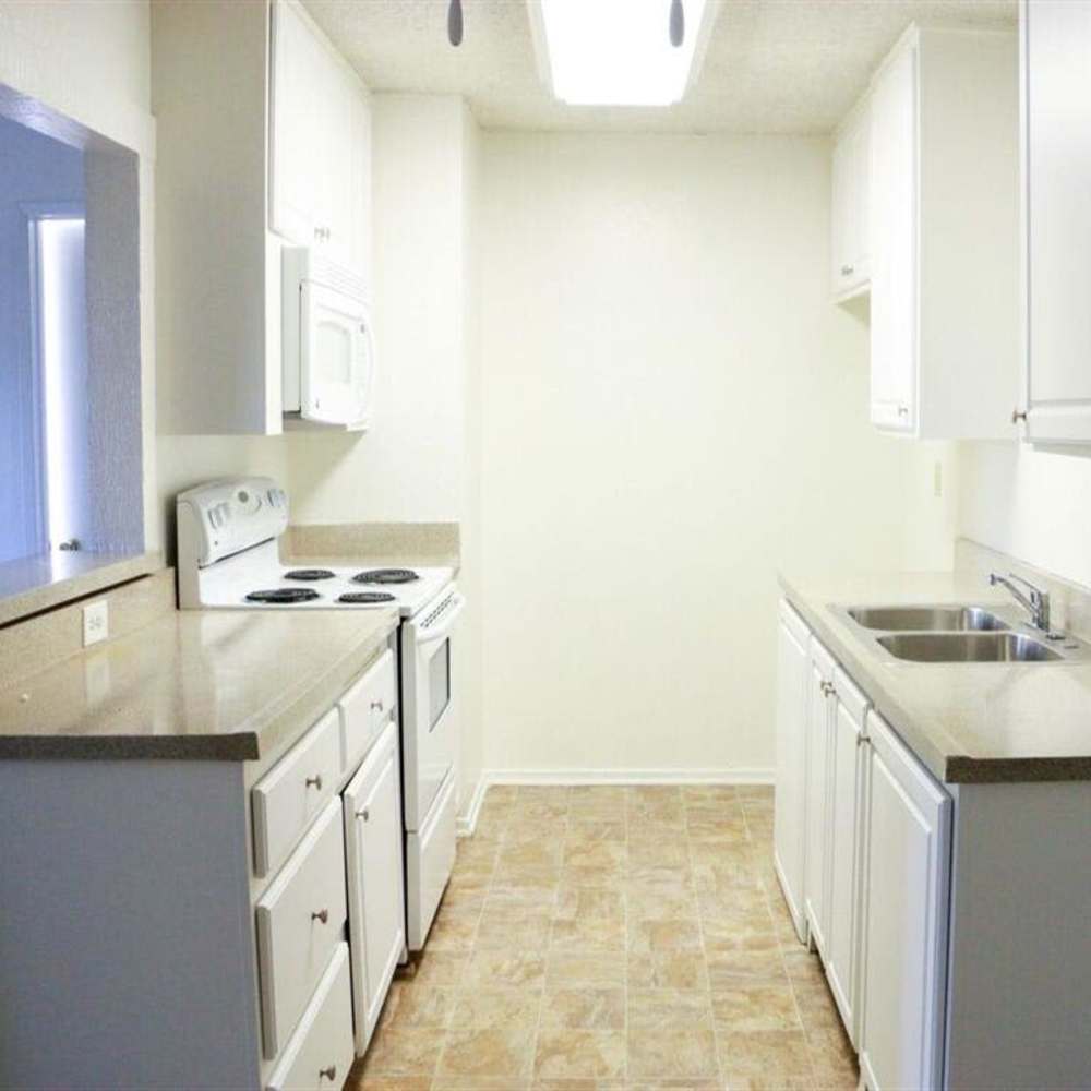 Well-lit galley-style kitchen at Casa Madrid in Cypress, California