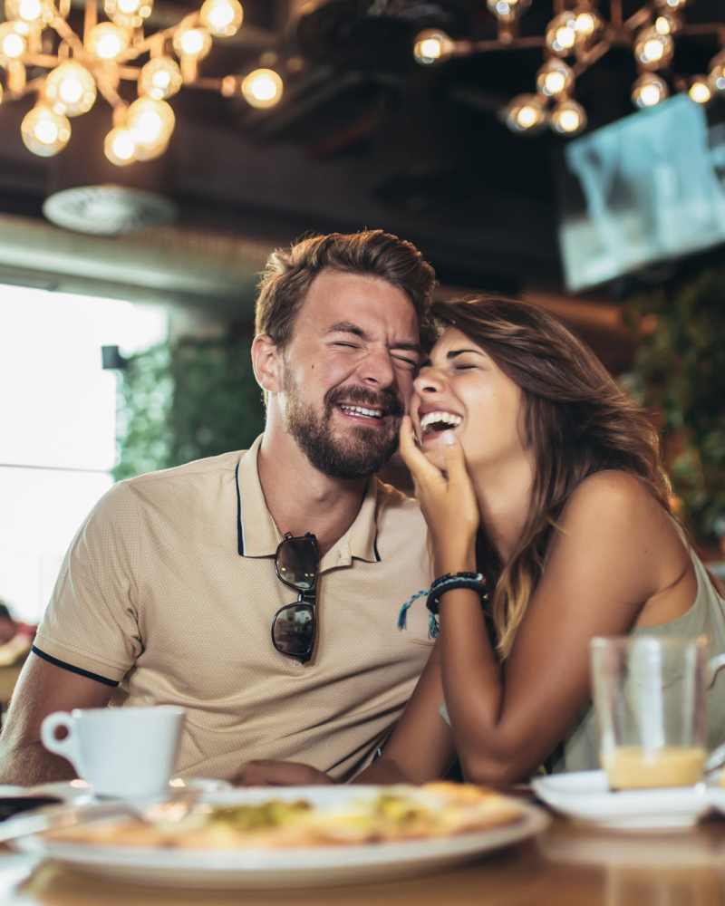 Happy couple enjoying dinner at Vivo Living Kissimmee in Kissimmee, Florida