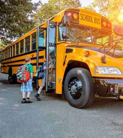 Resident kids going to school bus  near Lakeview in Fort Worth, Texas