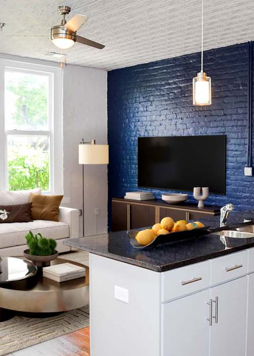 Model apartment kitchen and living room at Eclipse Apartments in Richmond, Virginia