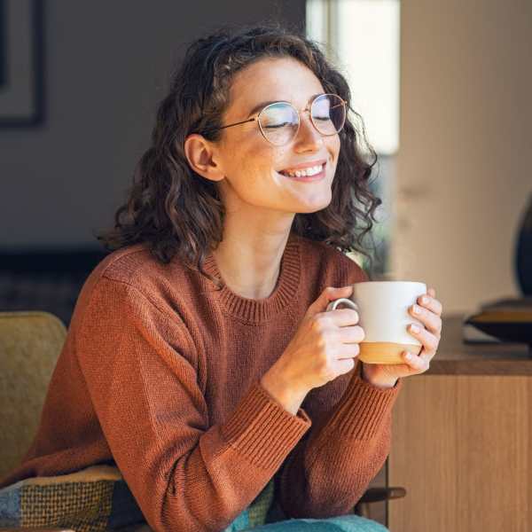 A resident sips coffee in her apartment at Magnolia Run, Virginia Beach, Virginia