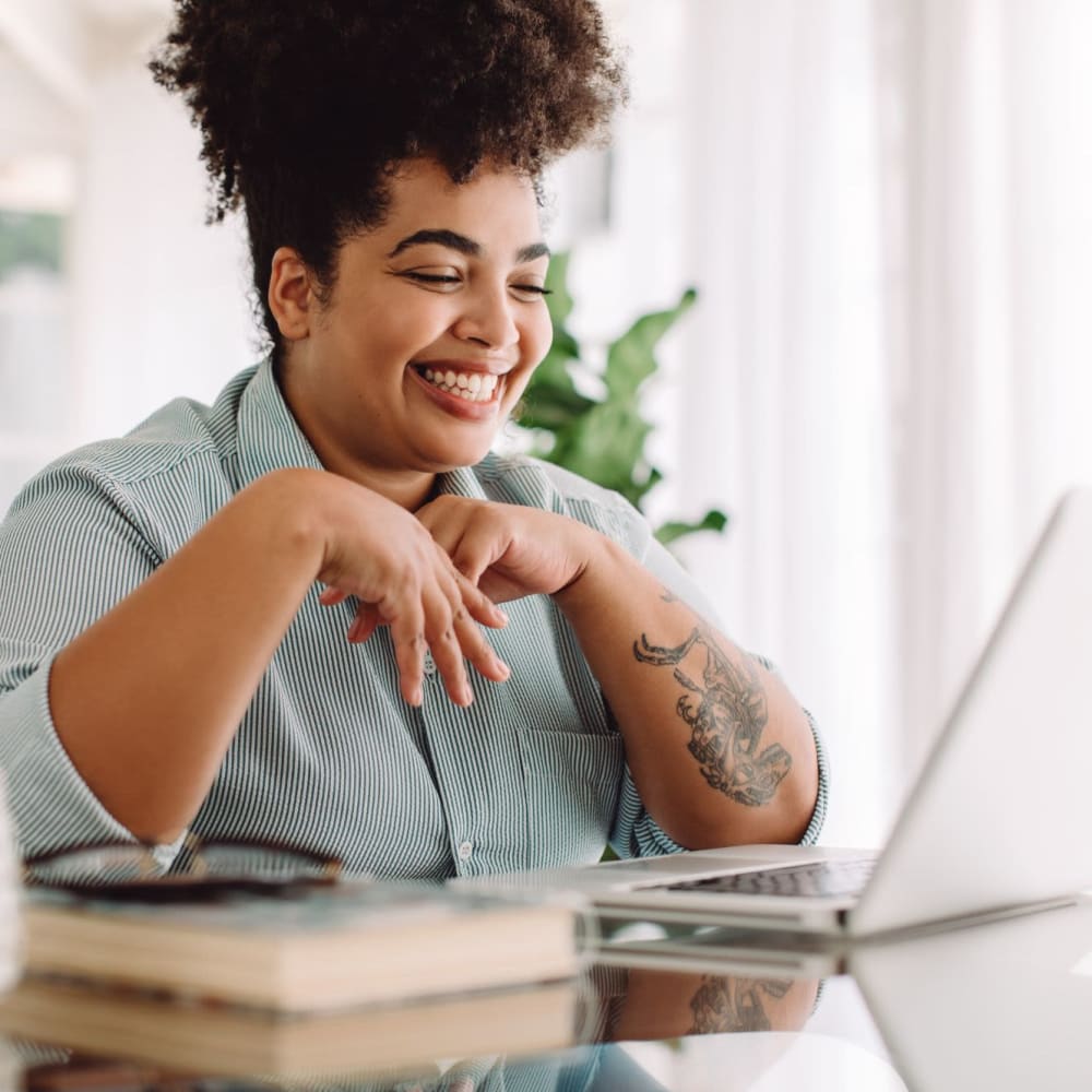 Resident working from her apartment at Lake Merritt Apartments in Oakland, California