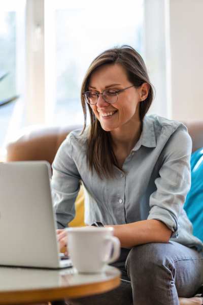 Woman on her computer while in her apartment at Lakeview in Reno, Nevada
