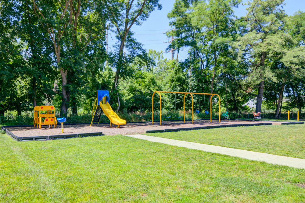 Apartments with a Playground equipped with a slide located at Lakeview Terrace Apartment Homes in Eatontown, New Jersey