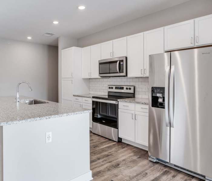 Kitchen with stainless-steel appliances at The Grove in Grand Rapids, Michigan