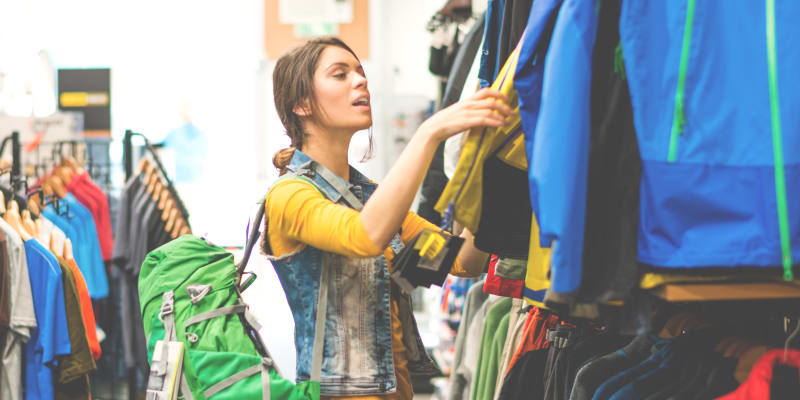 A resident shopping in a clothing store near The Village at Whitehurst Farm in Norfolk, Virginia