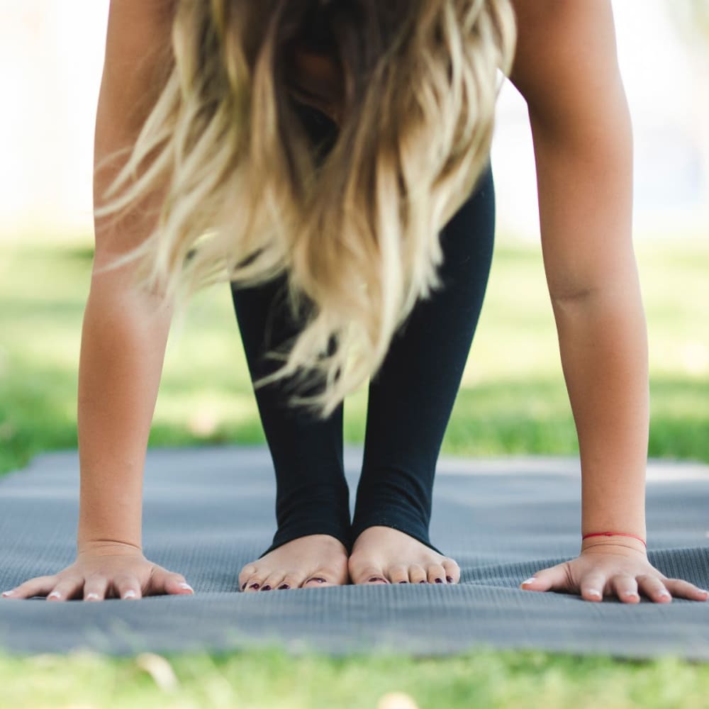 Resident doing yoga in the park near Veridian in Cincinnati, Ohio