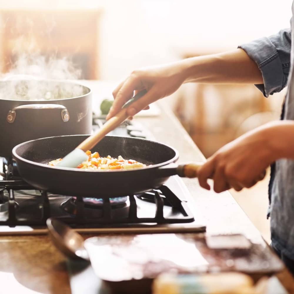 Resident cooking food in her apartment at Haven at Wild Dunes in Newport, North Carolina